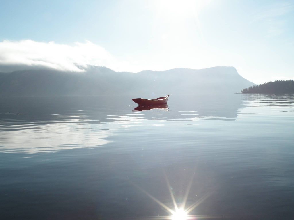 Boat on Maple Bay at sunrise